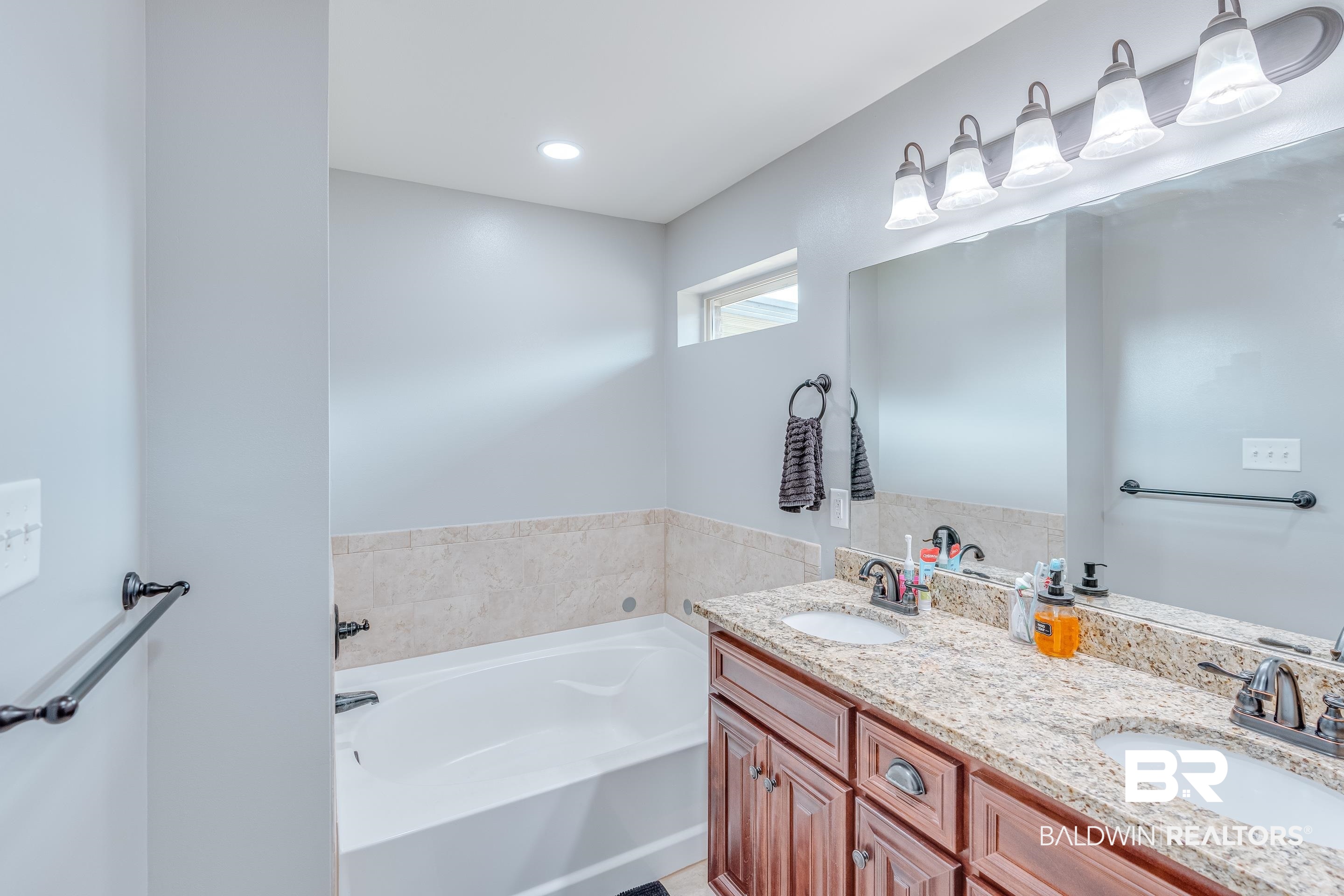 13235 Tom Gaston Road Mobile, AL 36695 - Photo 18 of 43 Bathroom featuring vanity and a bathing tub