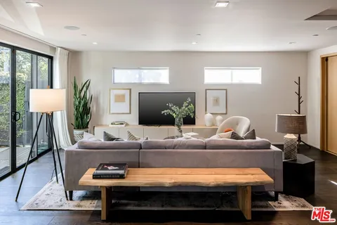 a living room with furniture and a table
