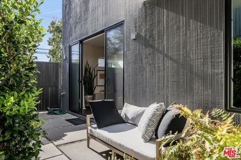 a view of a living room and outdoor space
