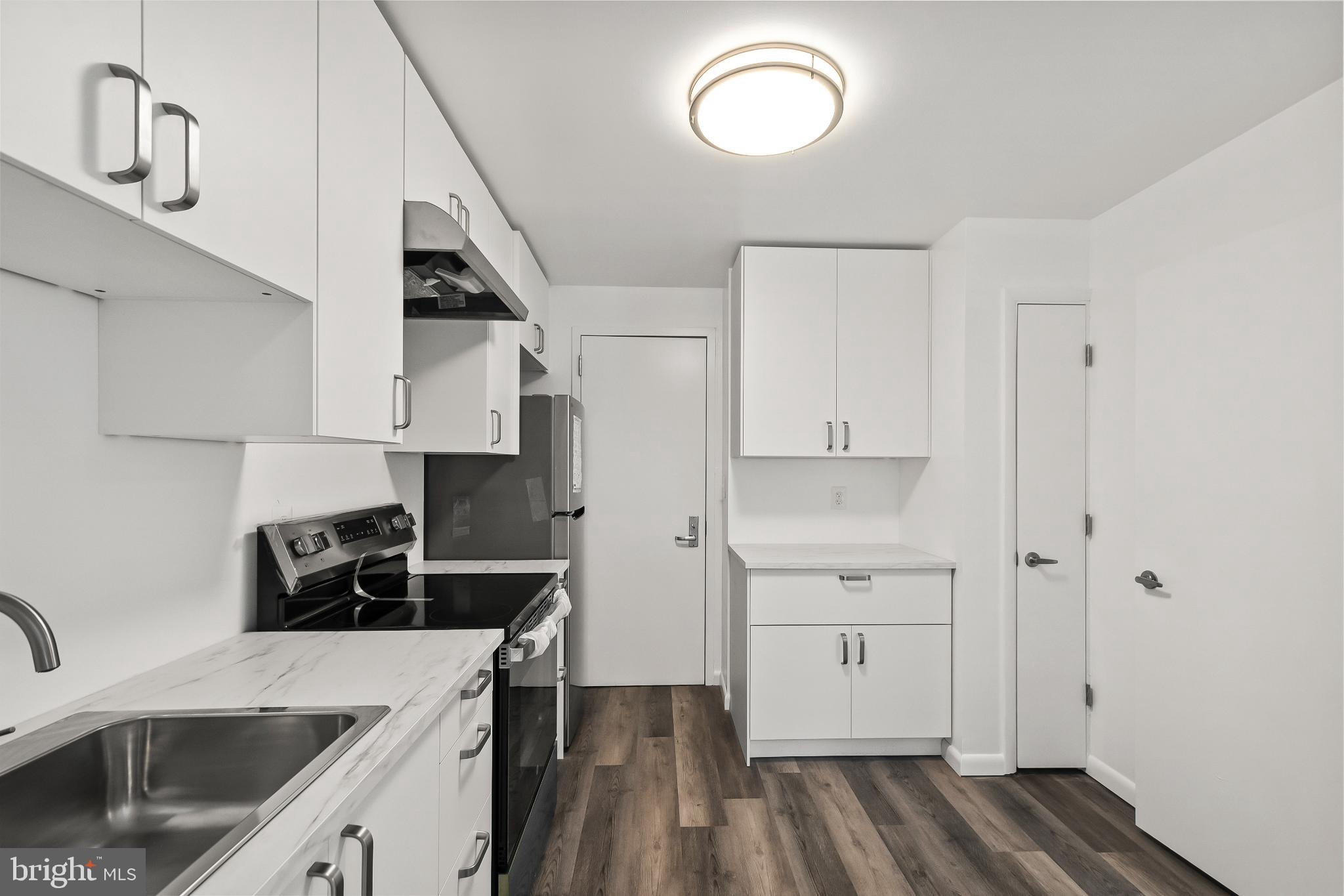 3601 Clarks Lane, Unit 322 Baltimore, MD 21215 - Photo 17 of 38 Modern kitchen with sleek finishes.