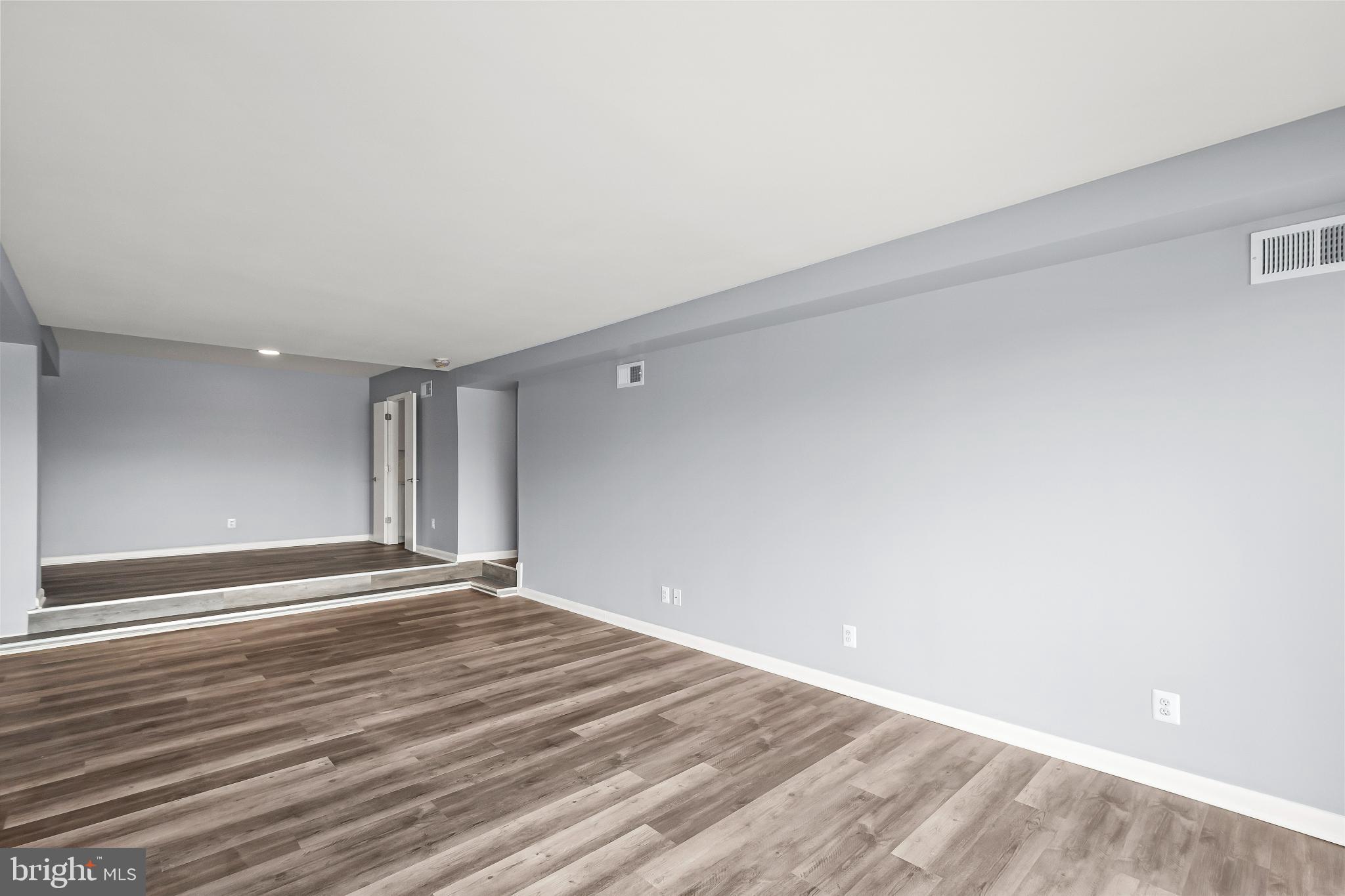3601 Clarks Lane, Unit 322 Baltimore, MD 21215 - Photo 31 of 38 View of living room to dining room (no staging).