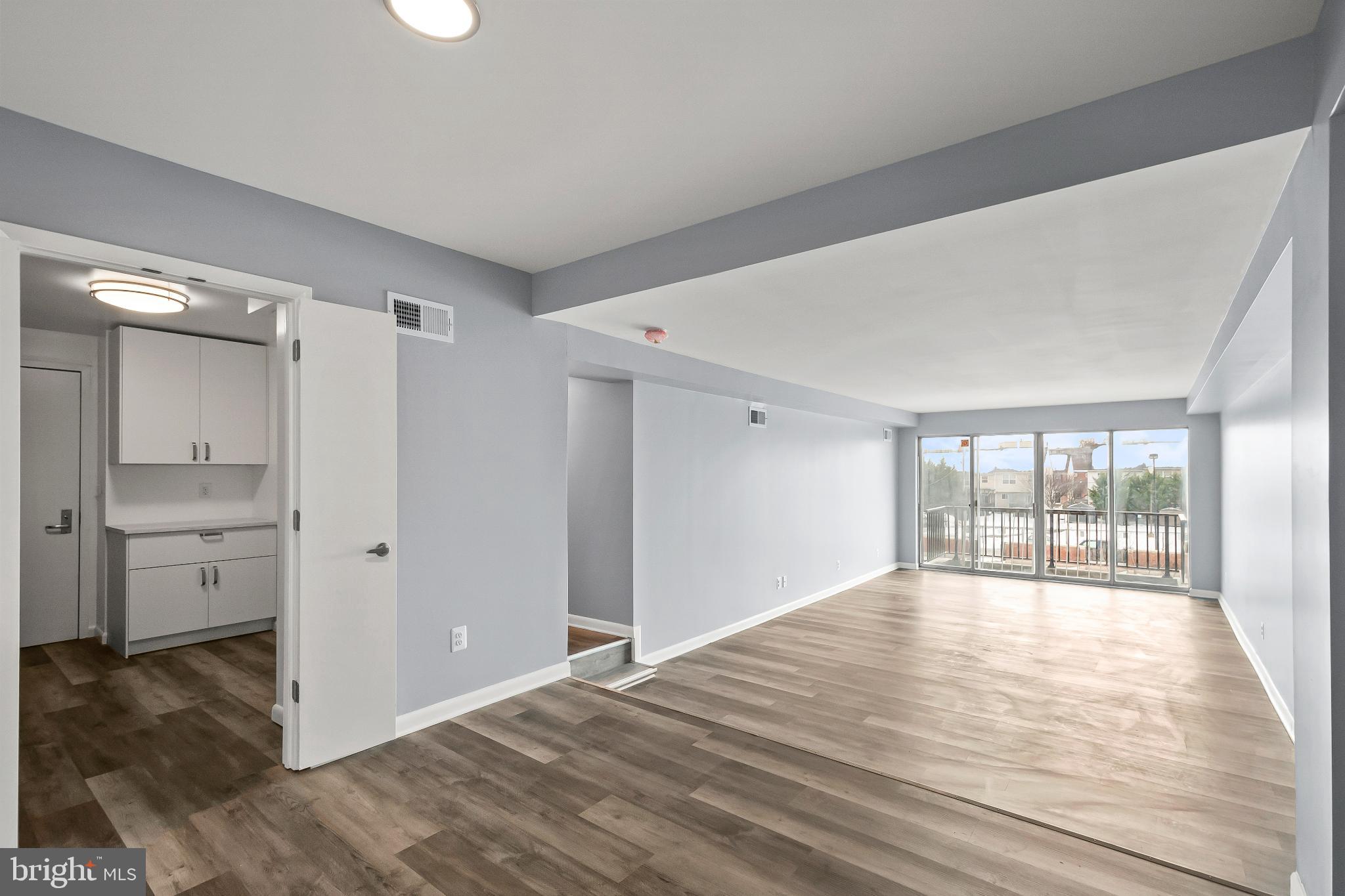 3601 Clarks Lane, Unit 322 Baltimore, MD 21215 - Photo 33 of 38 View of kitchen/dining area/living area/balcony.