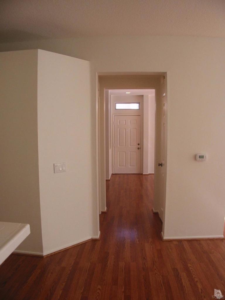4243 Rusticview Court Moorpark, CA 93021 - Photo 11 of 16 a view of a hallway with wooden floor