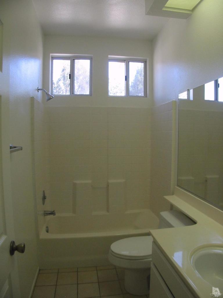 4243 Rusticview Court Moorpark, CA 93021 - Photo 14 of 16 a bathroom with a sink a toilet and shower