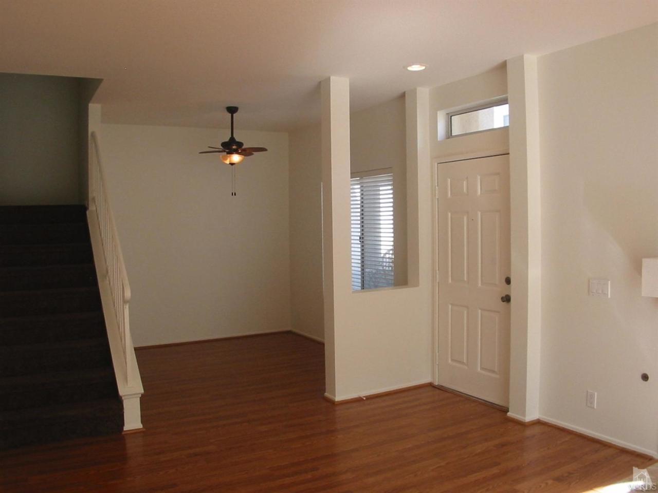 4243 Rusticview Court Moorpark, CA 93021 - Photo 8 of 16 wooden floor in an empty room with a window