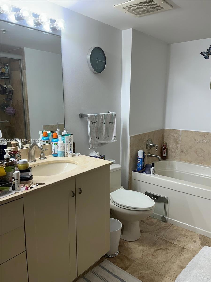 3232 Southwest 22nd Terrace, Unit 1607 Miami, FL 33145 - Photo 5 of 9 a bathroom with a sink toilet and a bathtub