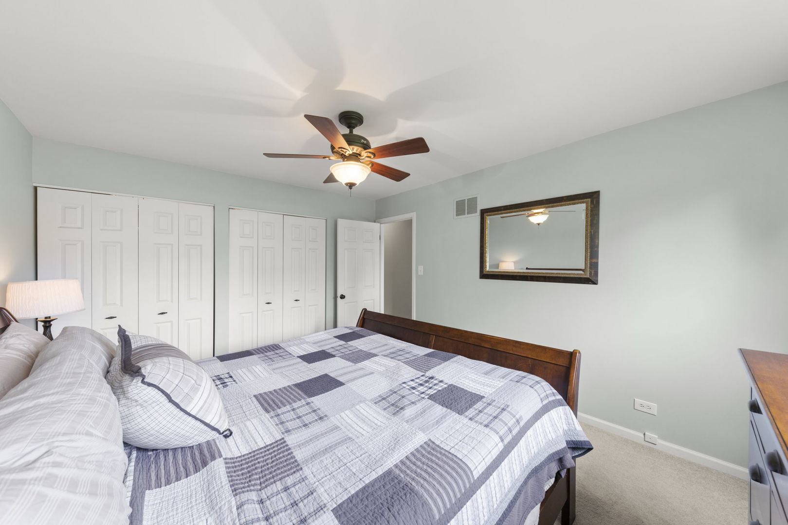 1635 South Prospect Street Wheaton, IL 60189 - Photo 22 of 53 a bedroom with a large bed and a chandelier