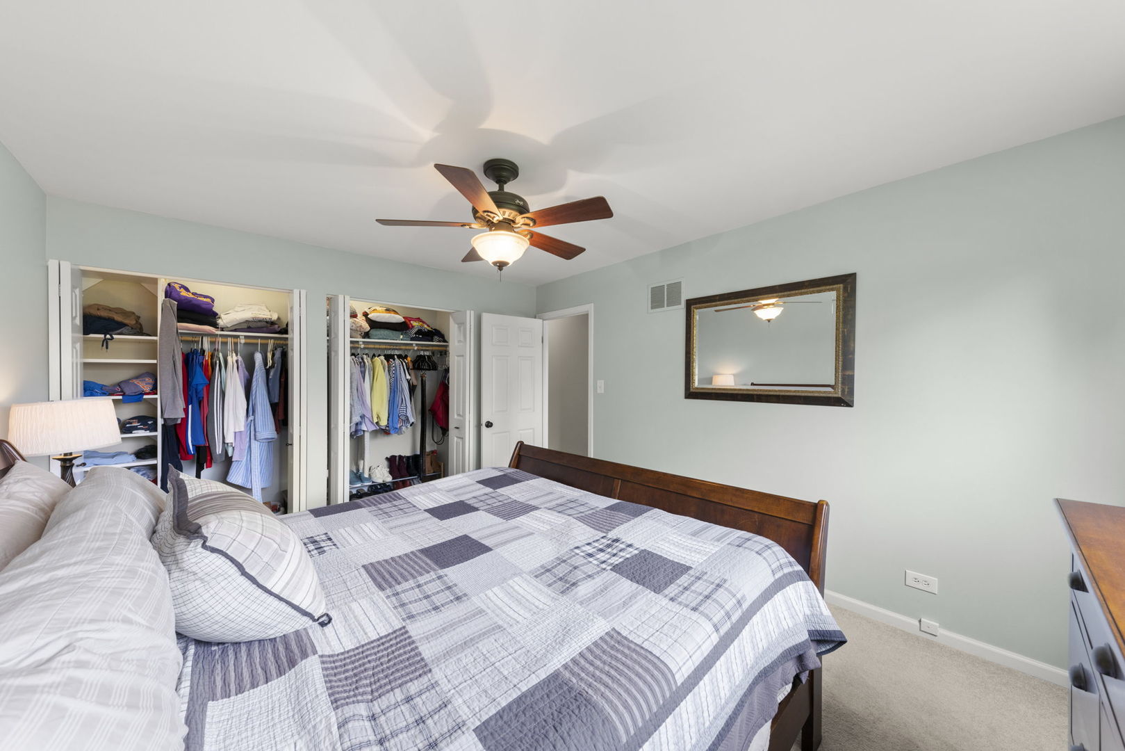 1635 South Prospect Street Wheaton, IL 60189 - Photo 23 of 53 a bed room with a bed and a large mirror