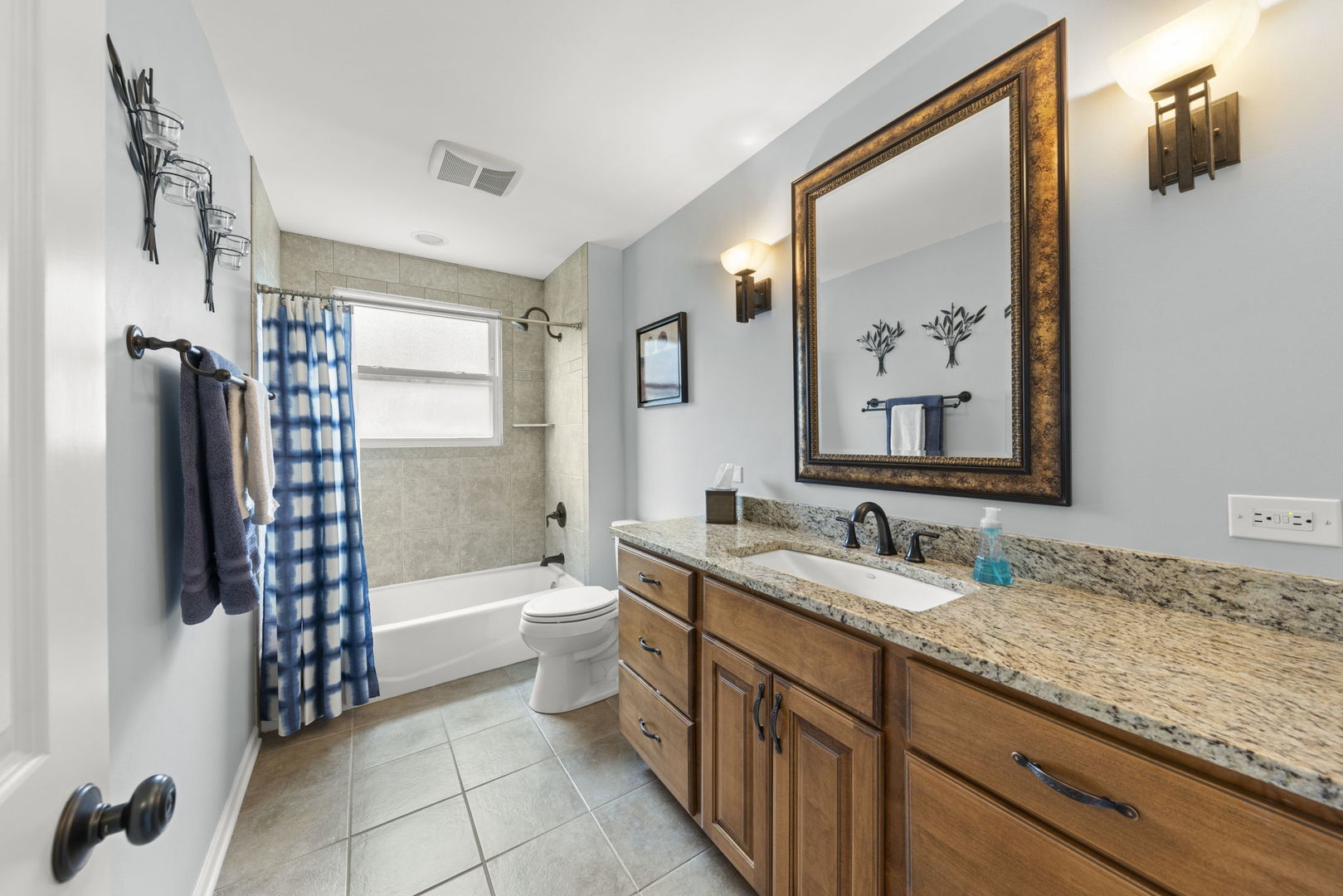 1635 South Prospect Street Wheaton, IL 60189 - Photo 24 of 53 a bathroom with a granite countertop sink mirror toilet and bathtub