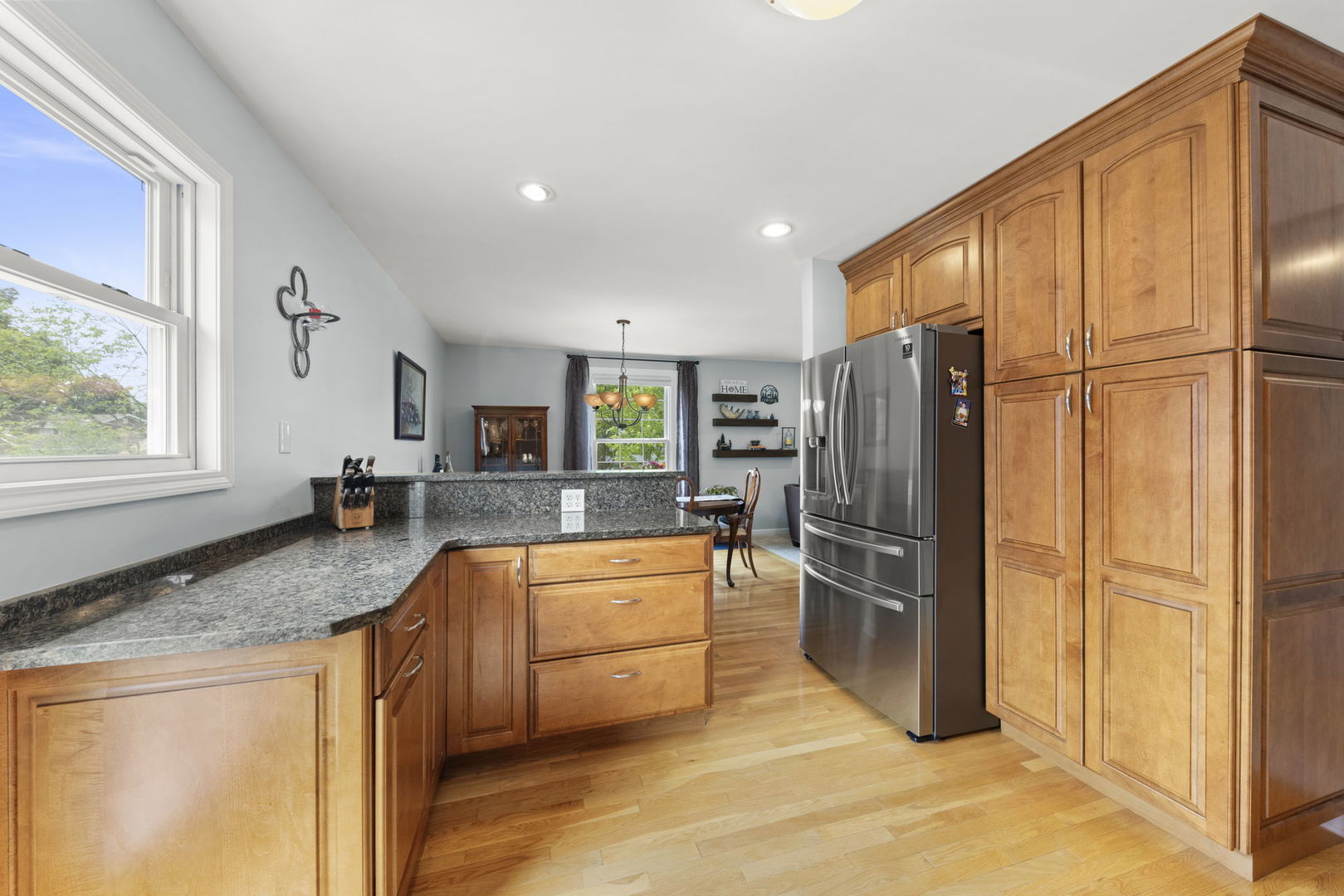 1635 South Prospect Street Wheaton, IL 60189 - Photo 8 of 53 a kitchen with stainless steel appliances granite countertop a refrigerator a stove a sink and a granite counter tops with white cabinets