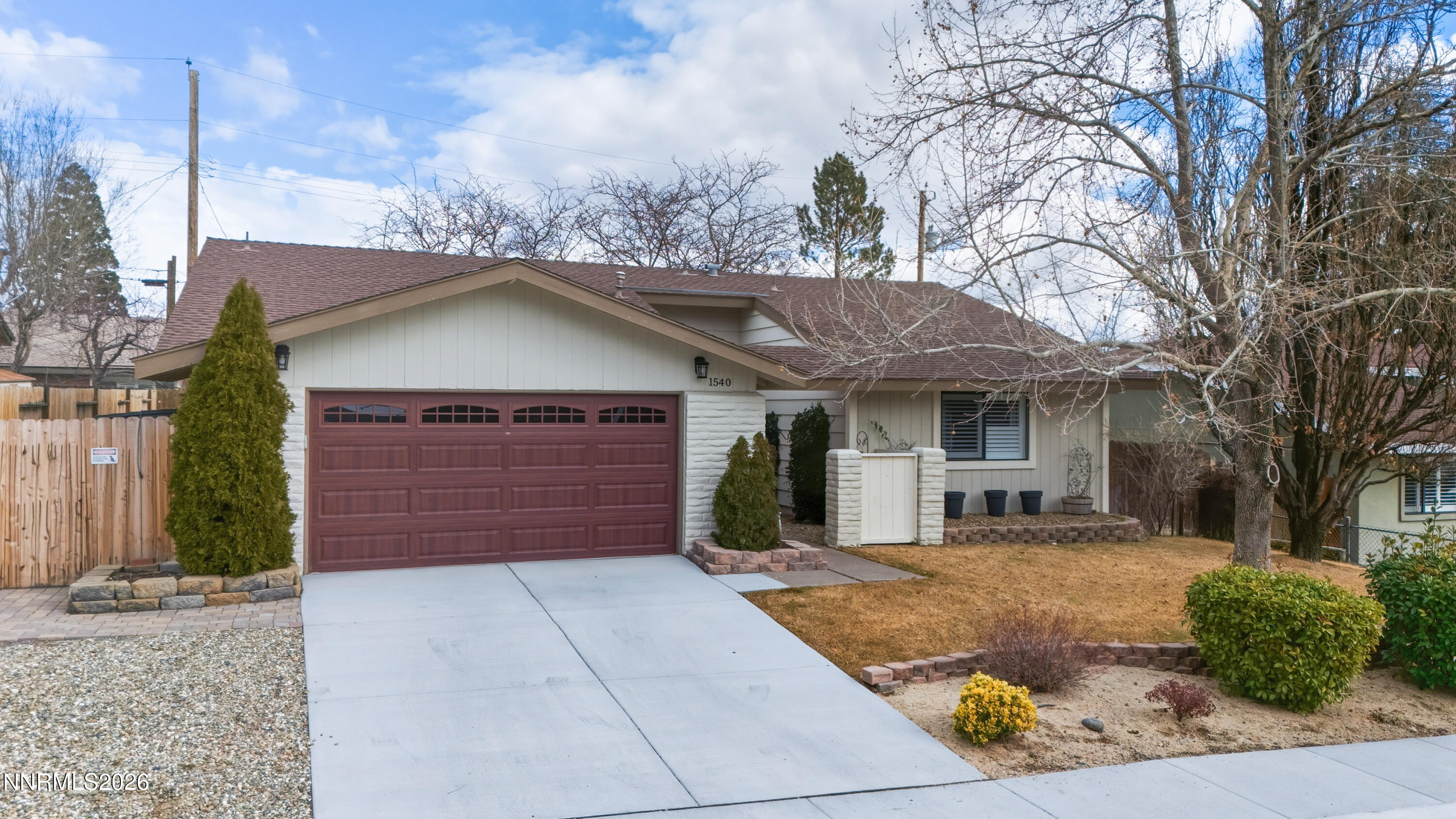 1540 O Farrell Street Reno, NV 89503 - Photo 1 of 41 a front view of a house with a yard and garage