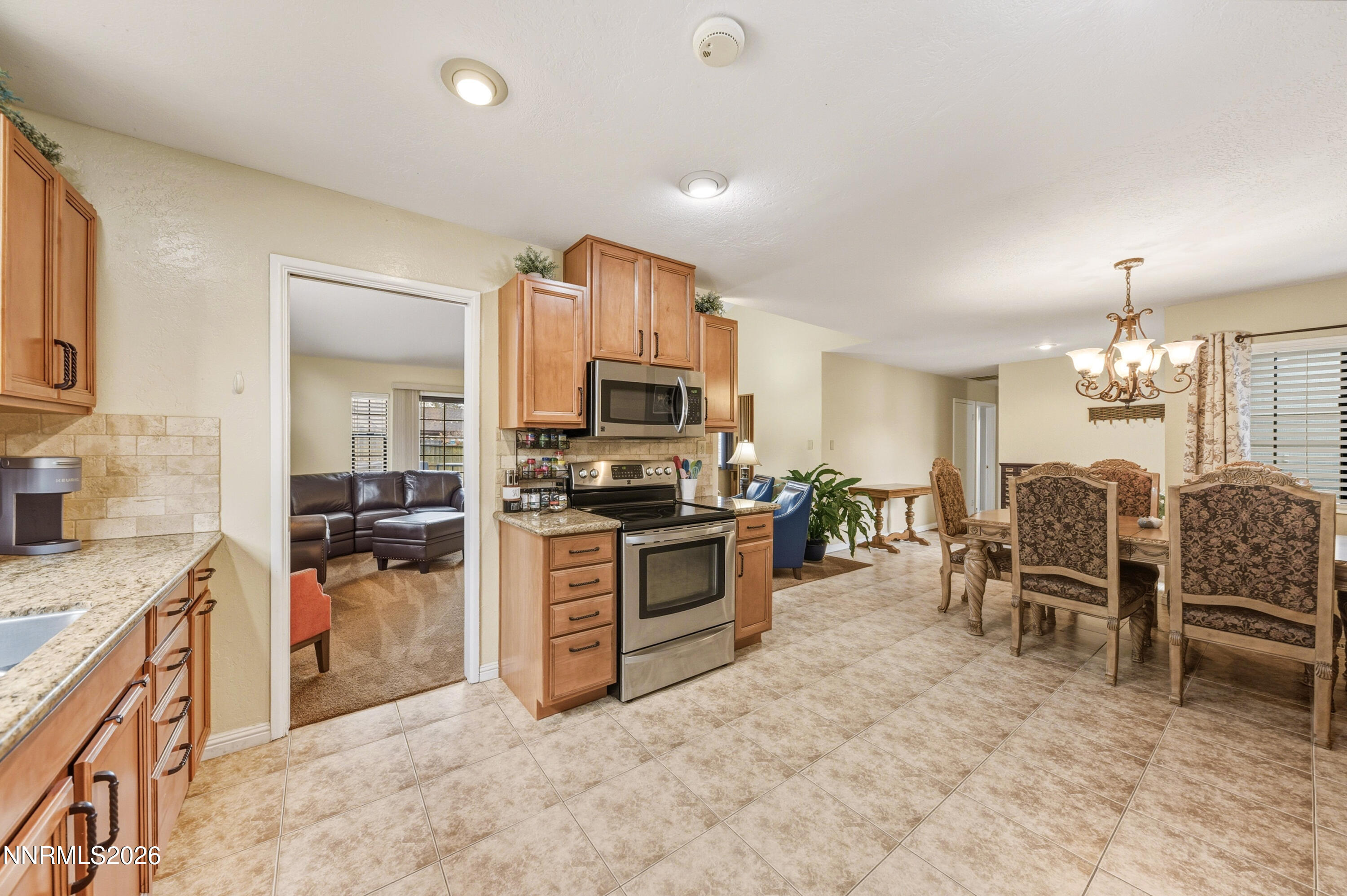 1540 O Farrell Street Reno, NV 89503 - Photo 11 of 41 a large kitchen with cabinets table and chairs