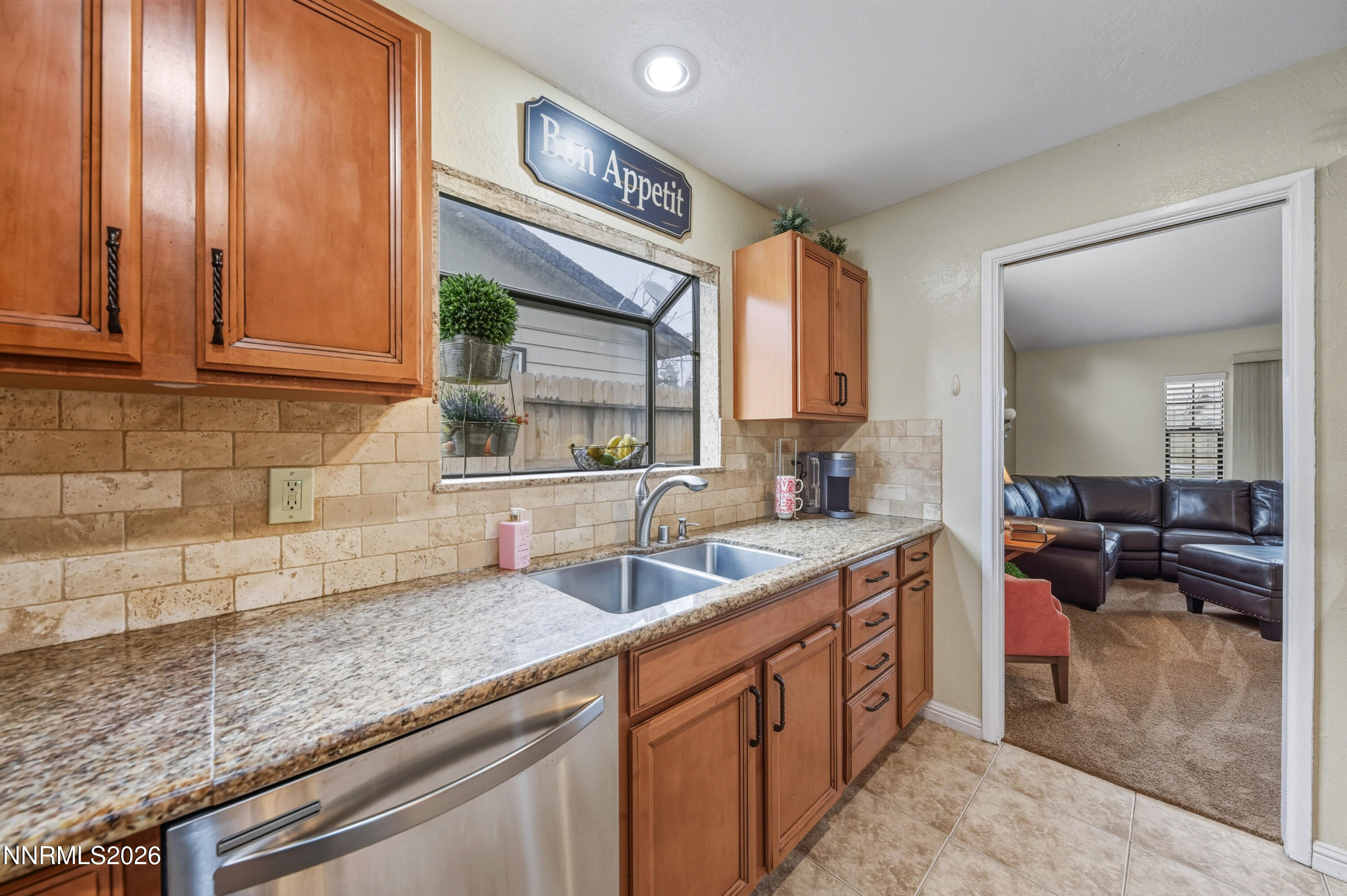 1540 O Farrell Street Reno, NV 89503 - Photo 12 of 41 a kitchen with stainless steel appliances granite countertop a sink stove and cabinets