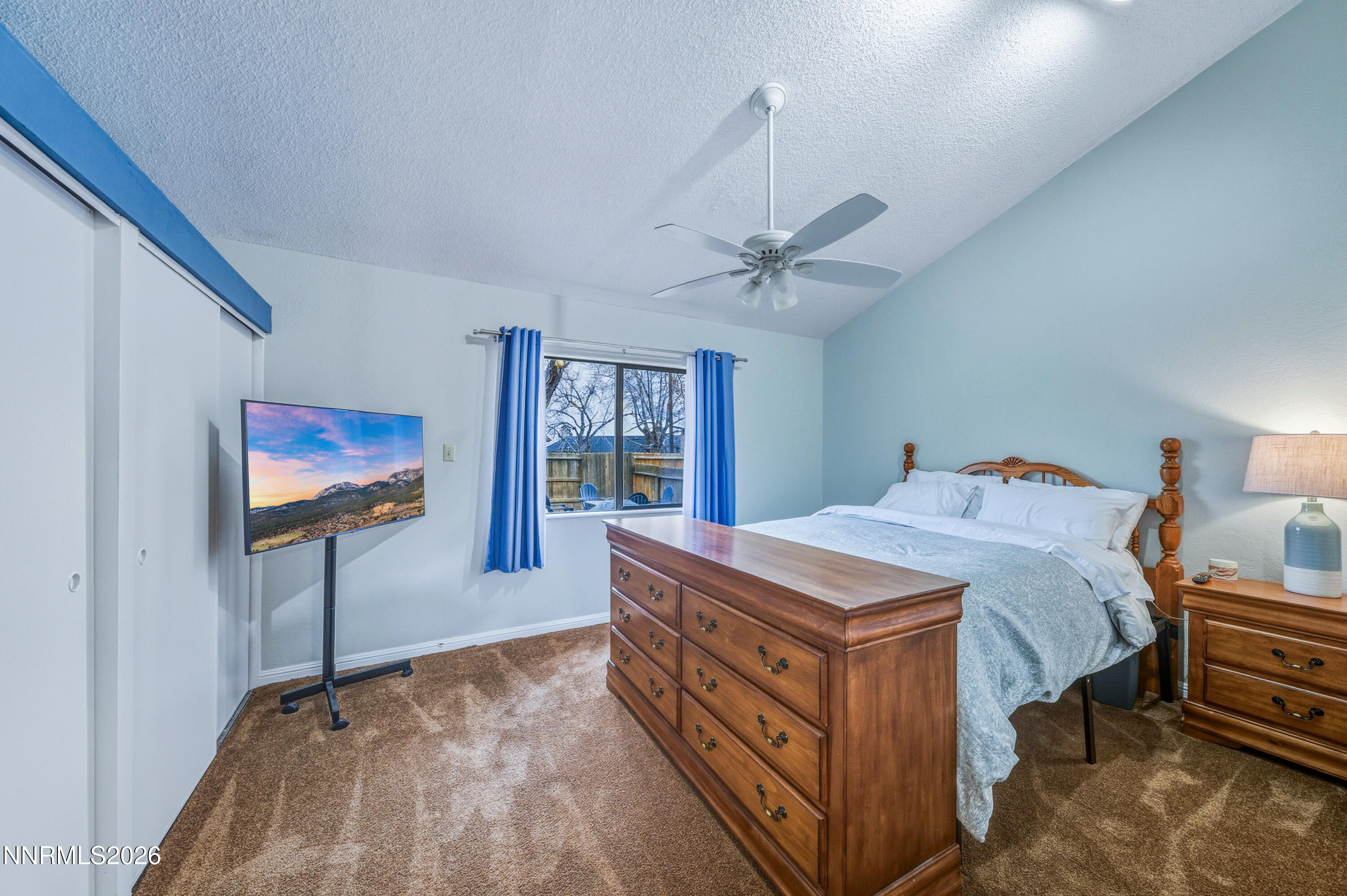 1540 O Farrell Street Reno, NV 89503 - Photo 18 of 41 a bed room with a bed and a chandelier