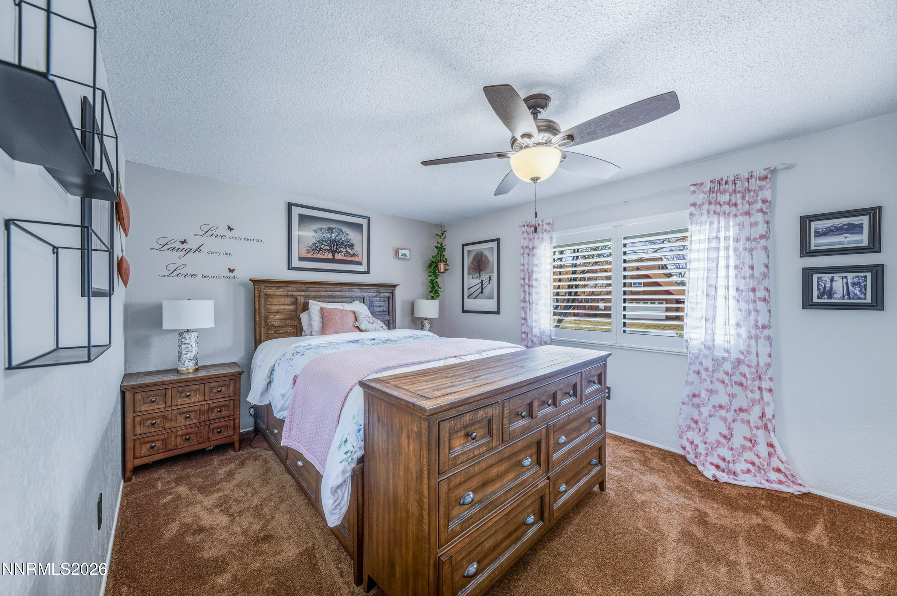 1540 O Farrell Street Reno, NV 89503 - Photo 23 of 41 a bedroom with a bed and a chandelier