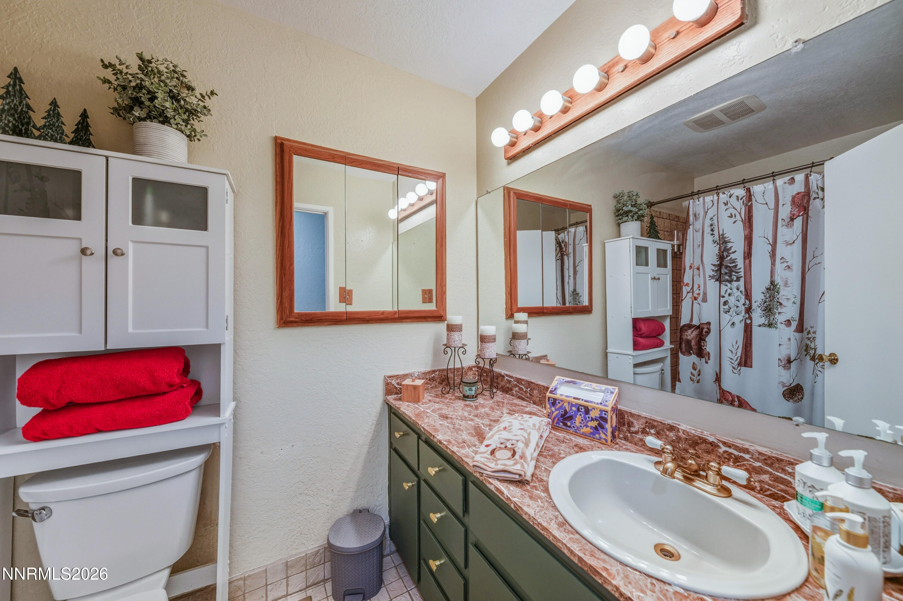 1540 O Farrell Street Reno, NV 89503 - Photo 24 of 41 a bathroom with a double vanity sink and a mirror