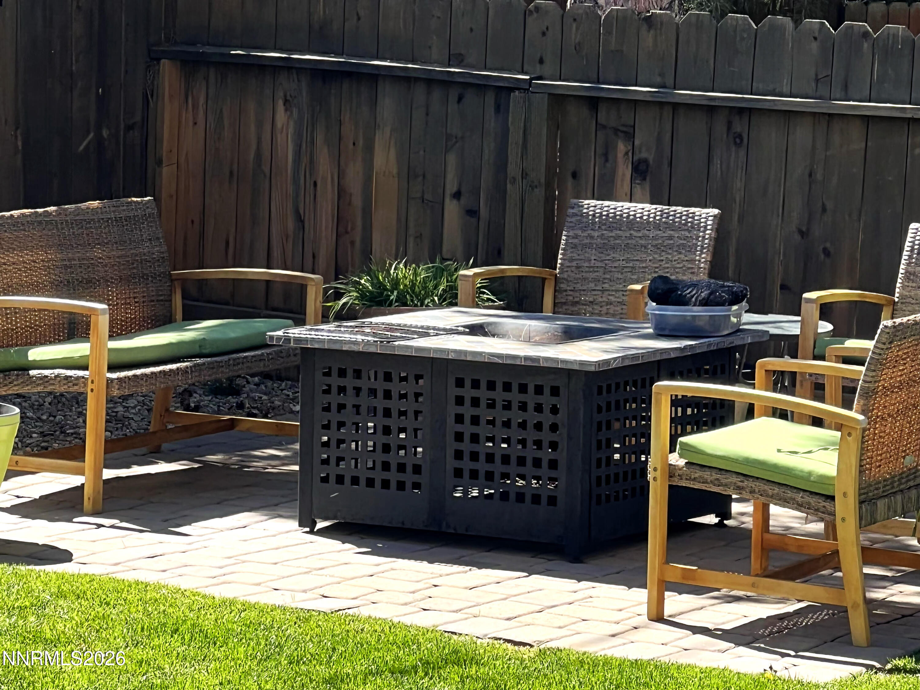 1540 O Farrell Street Reno, NV 89503 - Photo 30 of 41 a view of a patio with table and chairs with wooden fence