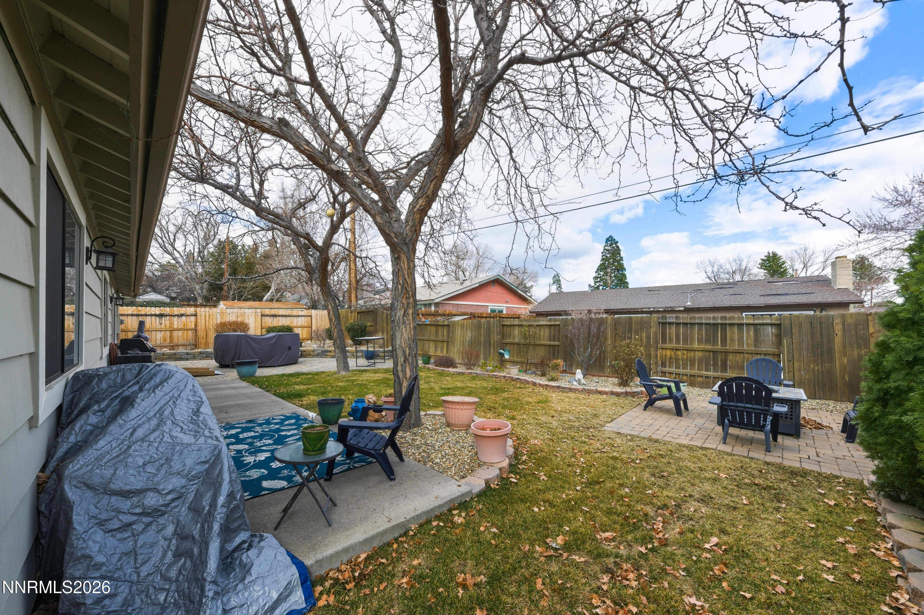 1540 O Farrell Street Reno, NV 89503 - Photo 34 of 41 a view of a patio with table and chairs and a barbeque