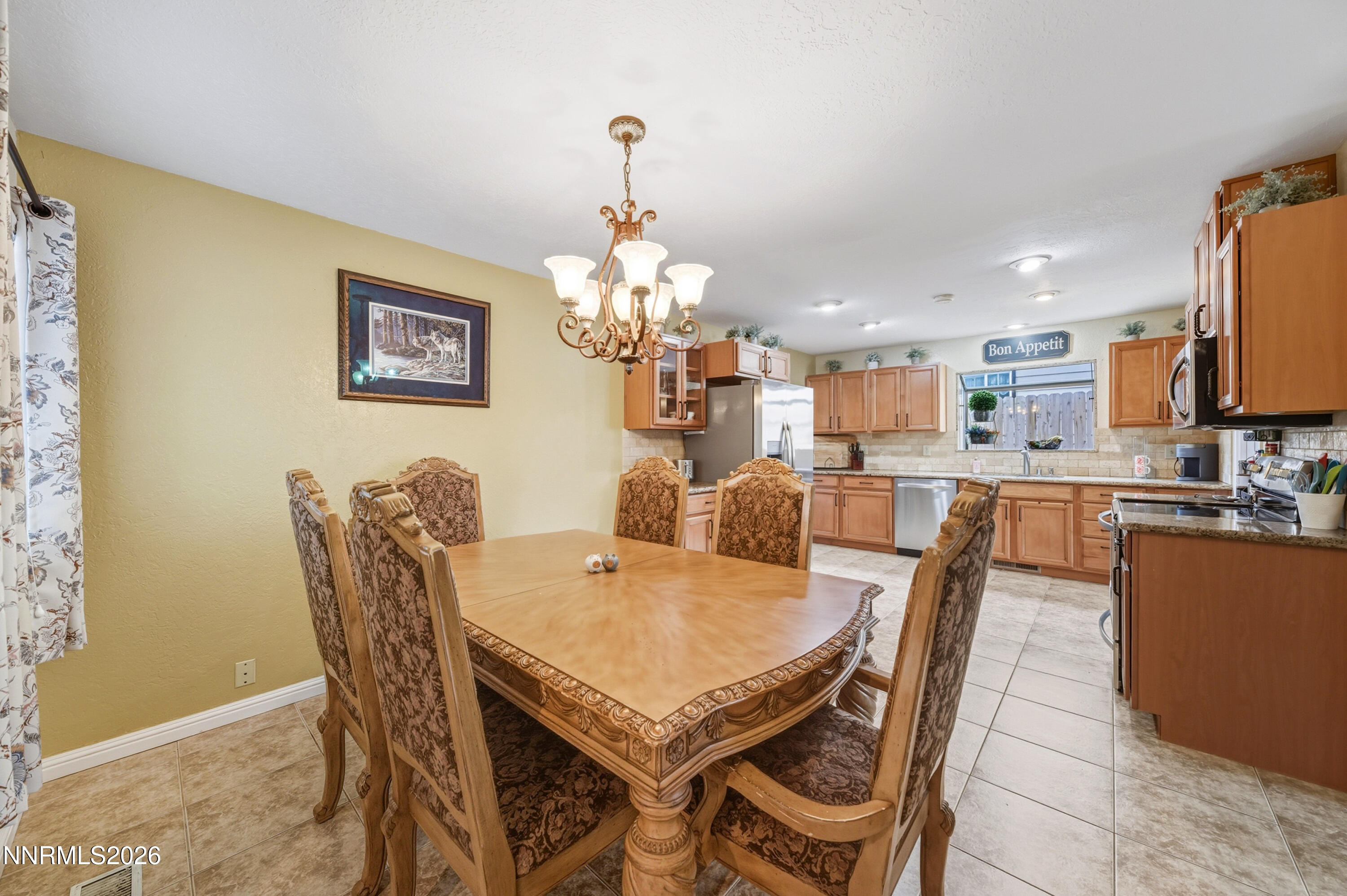1540 O Farrell Street Reno, NV 89503 - Photo 6 of 41 a view of a dining room with furniture and a chandelier