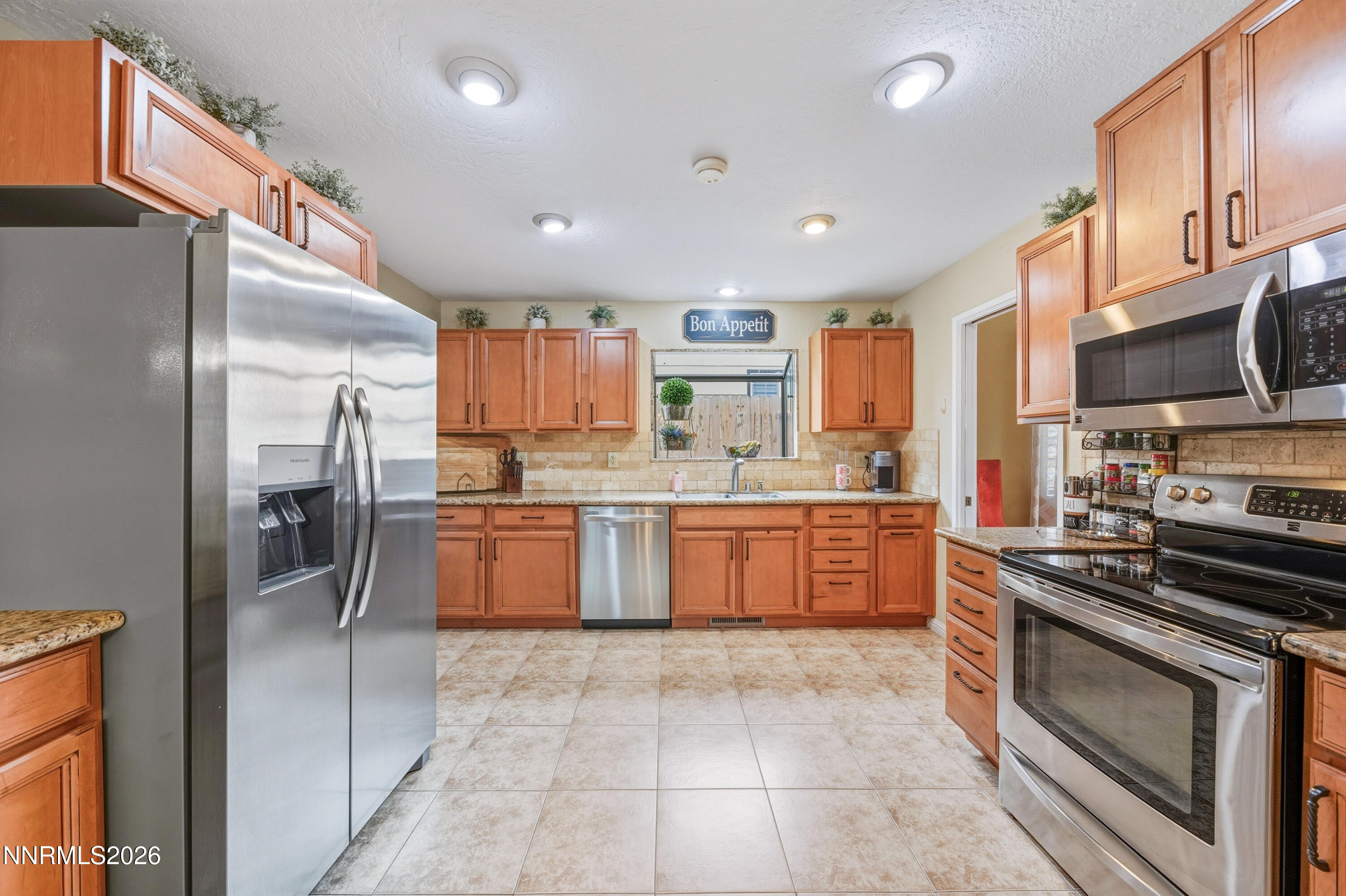 1540 O Farrell Street Reno, NV 89503 - Photo 9 of 41 a large kitchen with stainless steel appliances cabinets a sink and a counter top space