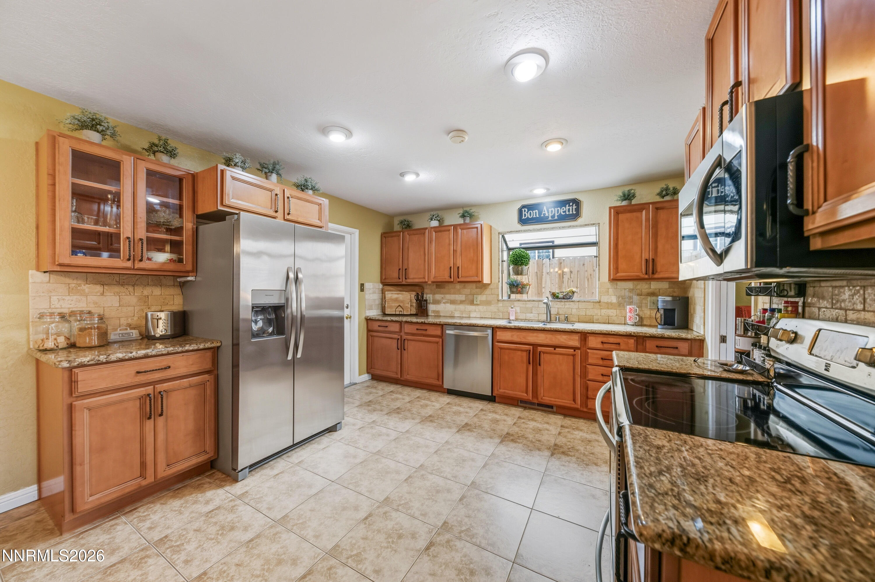 1540 O Farrell Street Reno, NV 89503 - Photo 10 of 41 a kitchen with granite countertop a sink a counter top space stainless steel appliances and cabinets