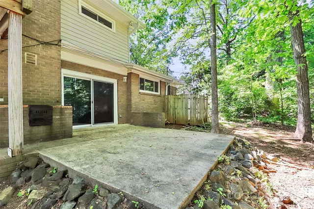 a view of a balcony with wooden fence