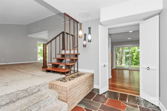 a room with gym equipment and a rug