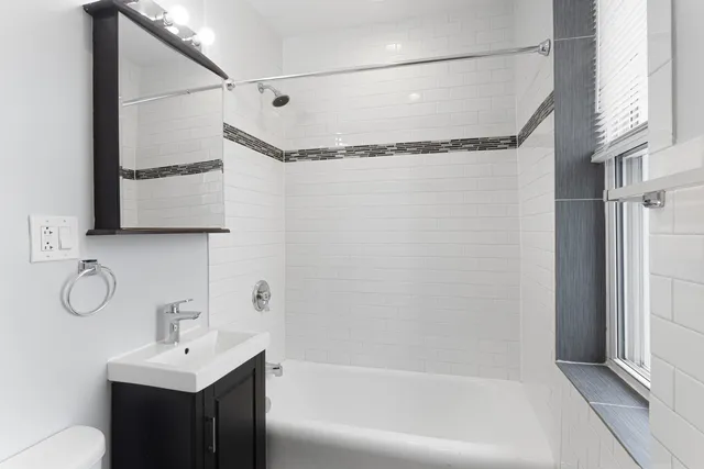 a bathroom with a shower curtain and a sink