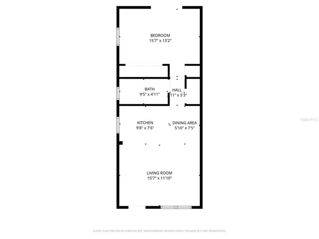 a picture of a bench in front of a wall