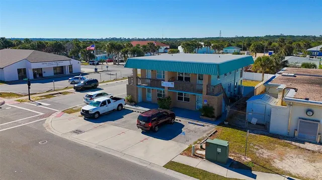 a view of a chairs and table in backyard