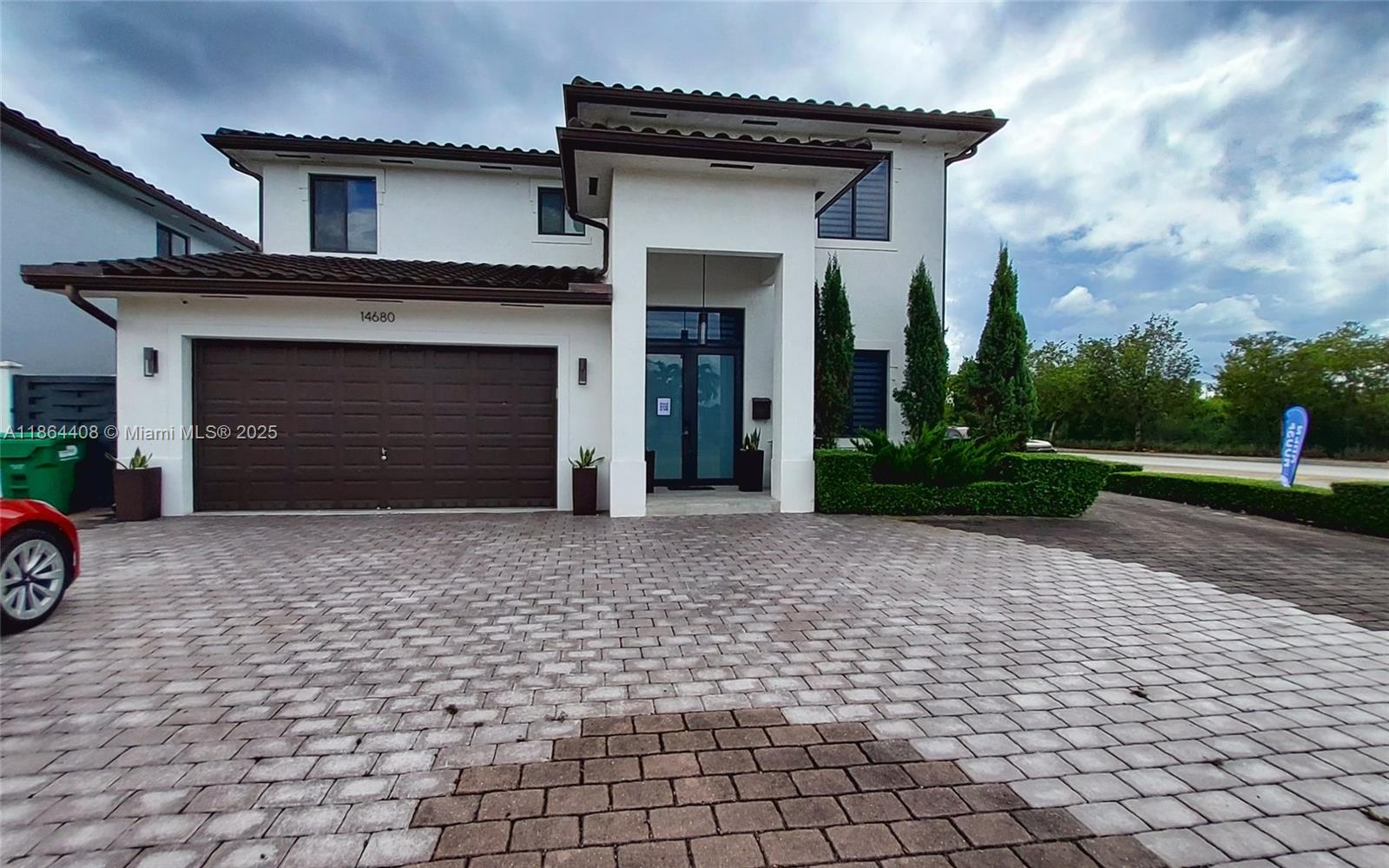 a front view of a house with a yard