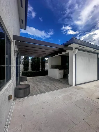 a spacious bathroom with a granite countertop sink and a mirror