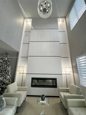 a view of hallway with livingroom and furniture