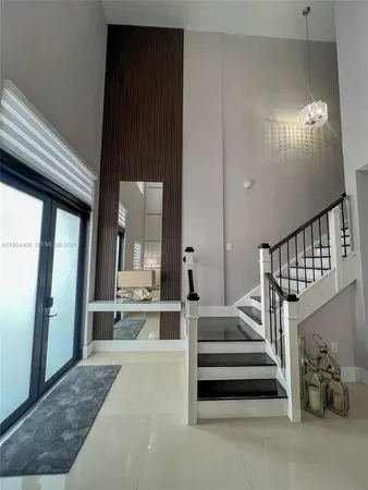 a room with lots of furniture and a rug