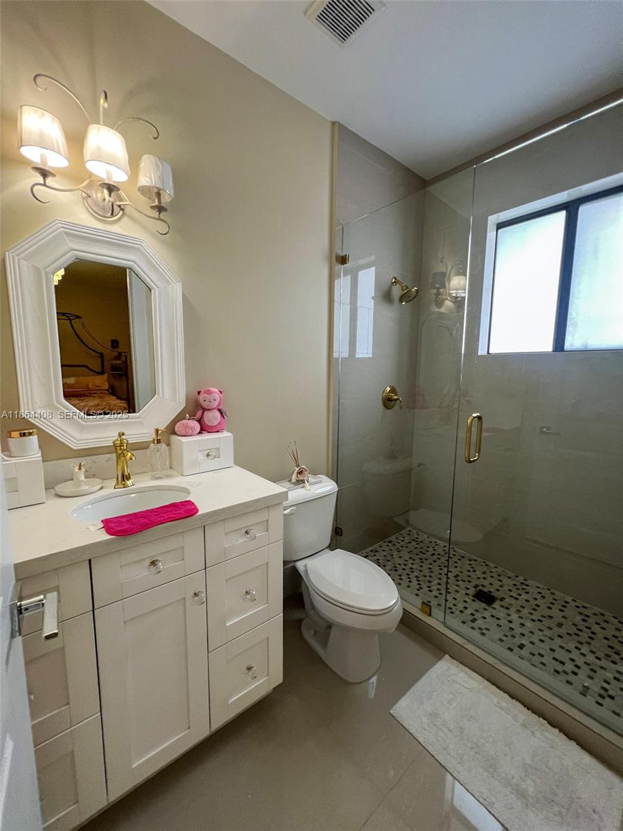 14680 Southwest 17th Street Miami, FL 33175 - Photo 38 of 68 a bathroom with a sink toilet and shower