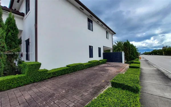 a front view of a house with garden