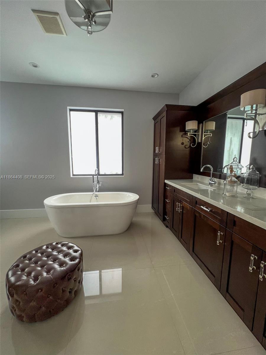 14680 Southwest 17th Street Miami, FL 33175 - Photo 51 of 68 a spacious bathroom with a sink and a mirror
