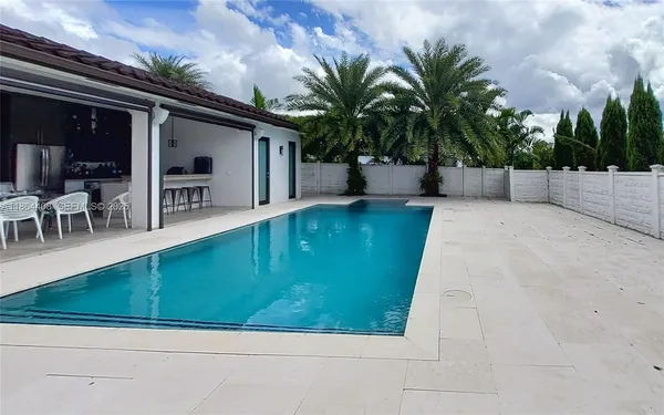 a view of a patio with swimming pool