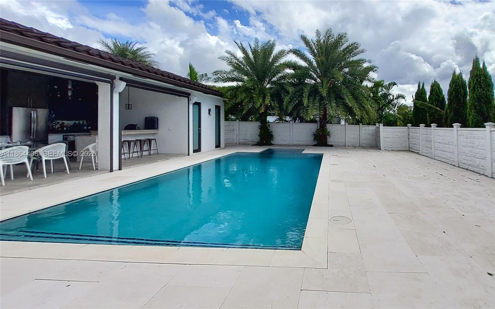 14680 Southwest 17th Street Miami, FL 33175 - Photo 9 of 68 a view of backyard with swimming pool and seating space