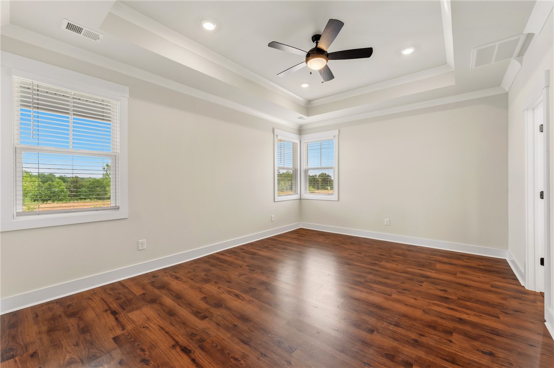 310 Bluestem Court Anderson, SC 29621 - Photo 21 of 36 This airy owners suite features abundant natural light, offering a comfortable and serene retreat.