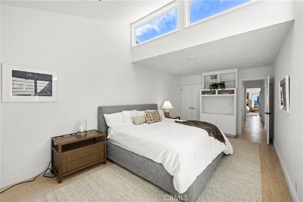 a bedroom with a bed and a cabinets