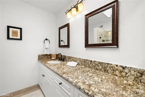 a bedroom with a bed and a cabinets