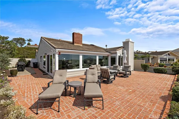 a view of a house with outdoor seating