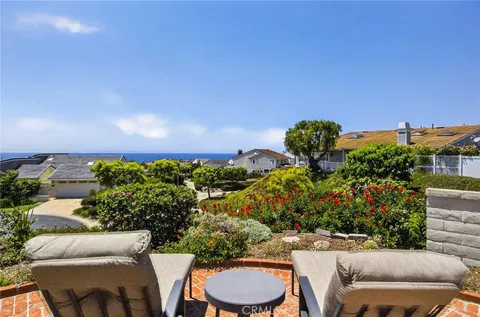 a view of a house with outdoor seating
