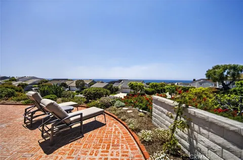 an aerial view of residential houses with outdoor space and swimming pool