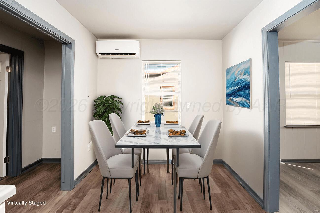 4224 South Polk Street Amarillo, TX 79110 - Photo 13 of 55 a view of a dining room with furniture and wooden floor