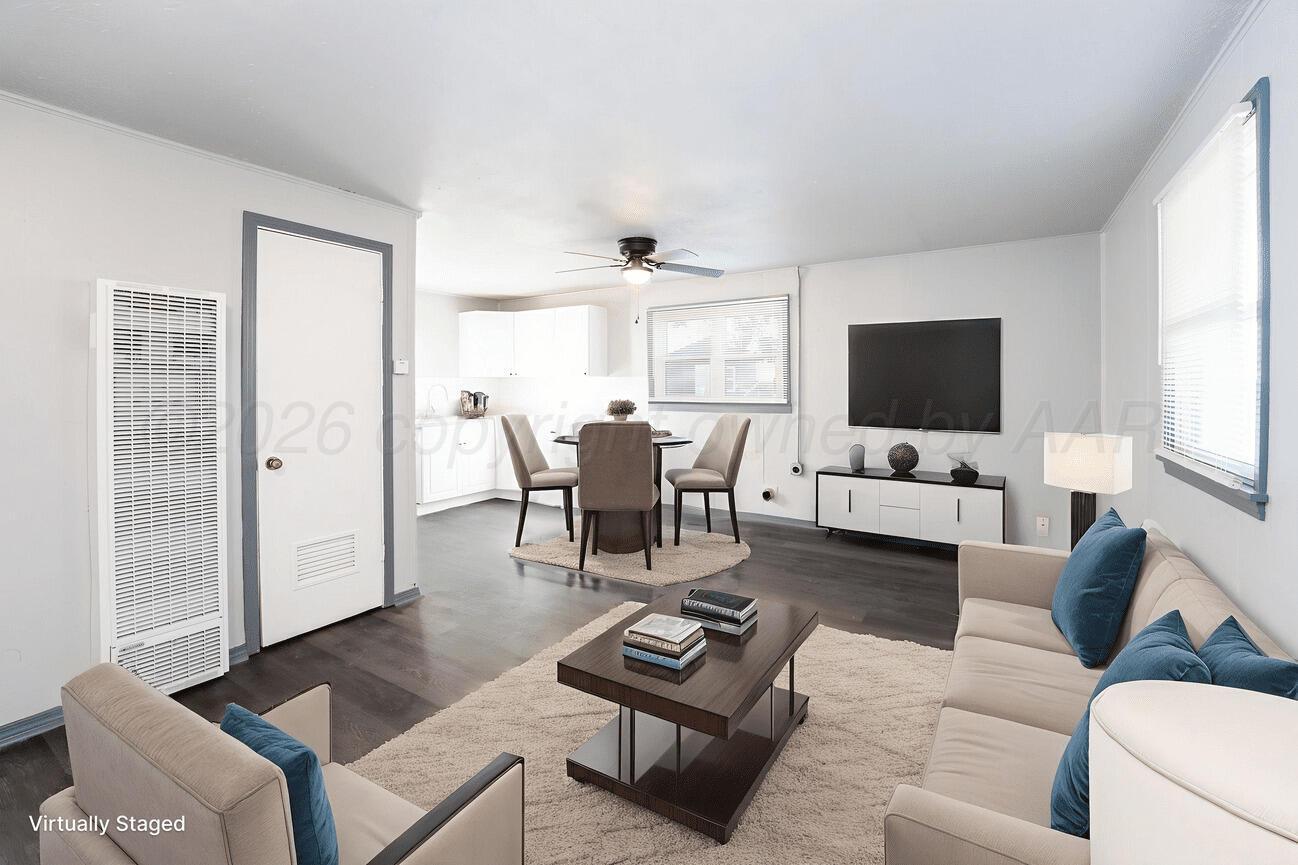 4224 South Polk Street Amarillo, TX 79110 - Photo 39 of 55 a living room with furniture and a flat screen tv