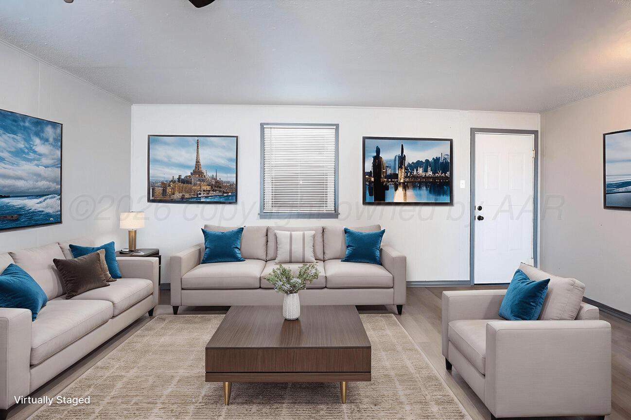 4224 South Polk Street Amarillo, TX 79110 - Photo 42 of 55 a living room with furniture and a painting on the wall