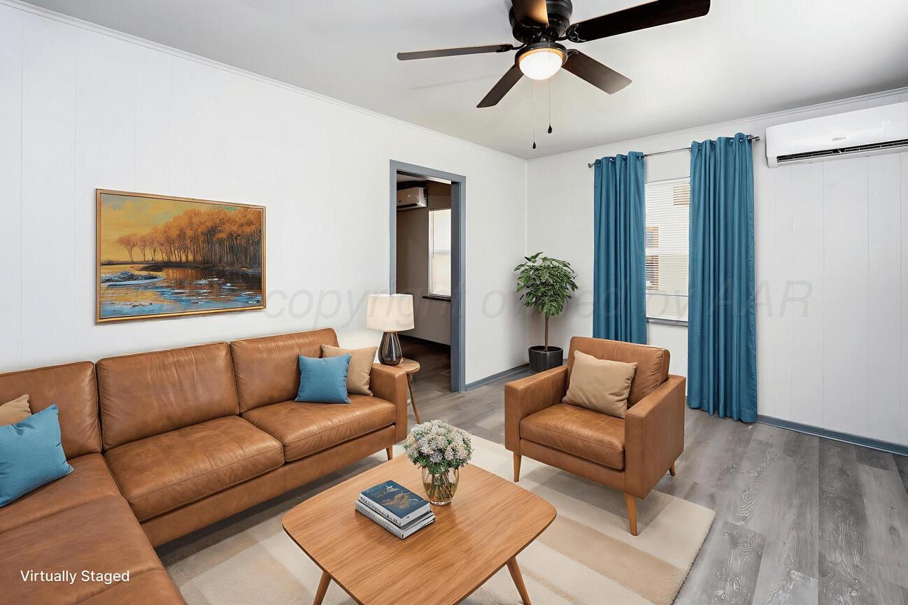 4224 South Polk Street Amarillo, TX 79110 - Photo 5 of 55 a living room with furniture and a window