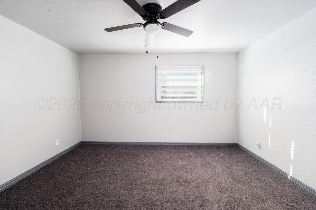 4224 South Polk Street Amarillo, TX 79110 - Photo 53 of 55 an empty room with a ceiling fan and window